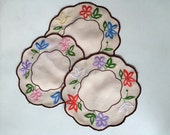 Round embroidered doilies, set of three, centerpieces with trimmed arched edges and fine embroidered flowers