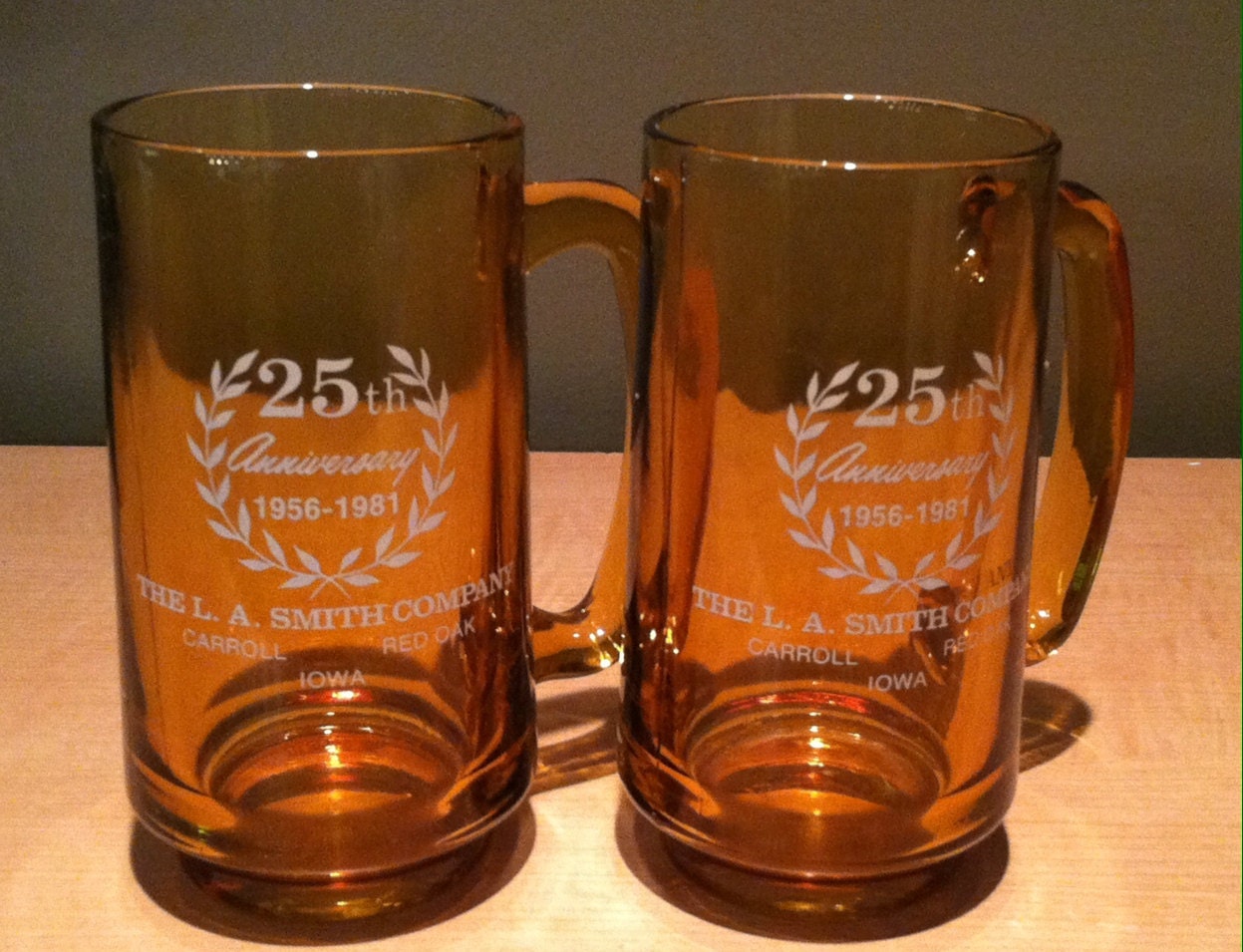 Vintage pair of collectible beer glasses commemorating the