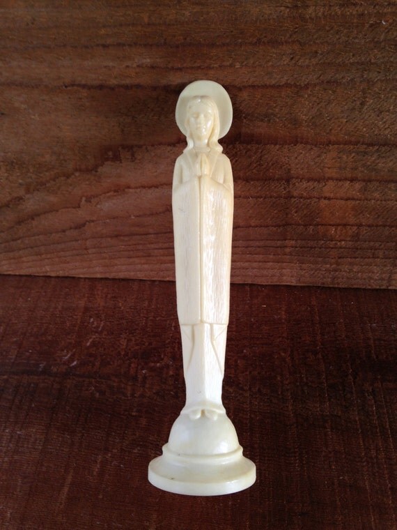 miniature virgin mary statue