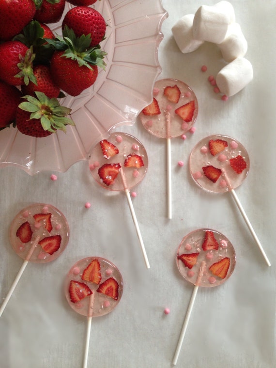3 Marshmallow flavored lollipops with organic strawberries, strawberry chocolate pearl crisps, and silver glitter hearts