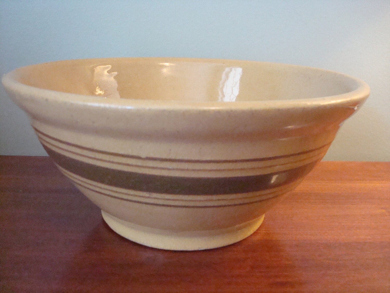 Nice vintage yellow ware pottery bowl with brown stripes
