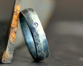 sterling silver man's ring band with flush set diamond and hammered organic texture, distressed satin finish