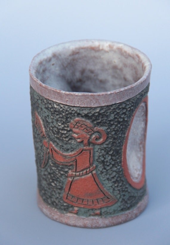 Viking mead glass with carved pattern of a Viking woman