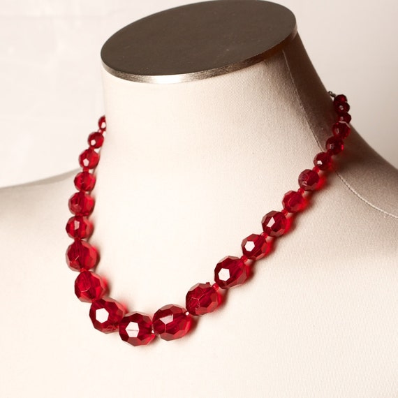 red plastic bead necklace