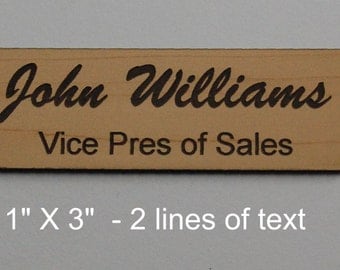 Laser engraved personalized 1" X 3" name tags cut from solid 1/16" thick plastic with pin or magnetic holders.