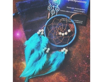 Blue dream catcher, faux suede, brown web with blue rooster feathers and pearl bead spiral finish 7cm diameter - dreamcatcher hand made