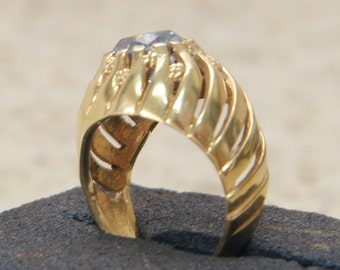 9 ct solid gold dress ring with a light blue center stone