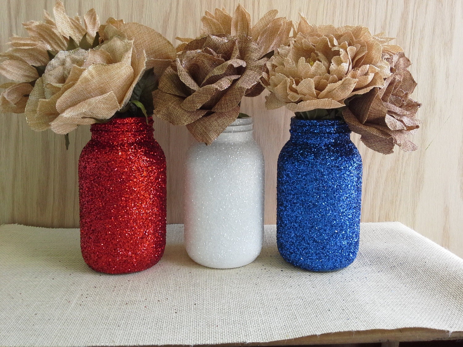 Beautiful red, white & blue glitter patriotic Mason Jars.