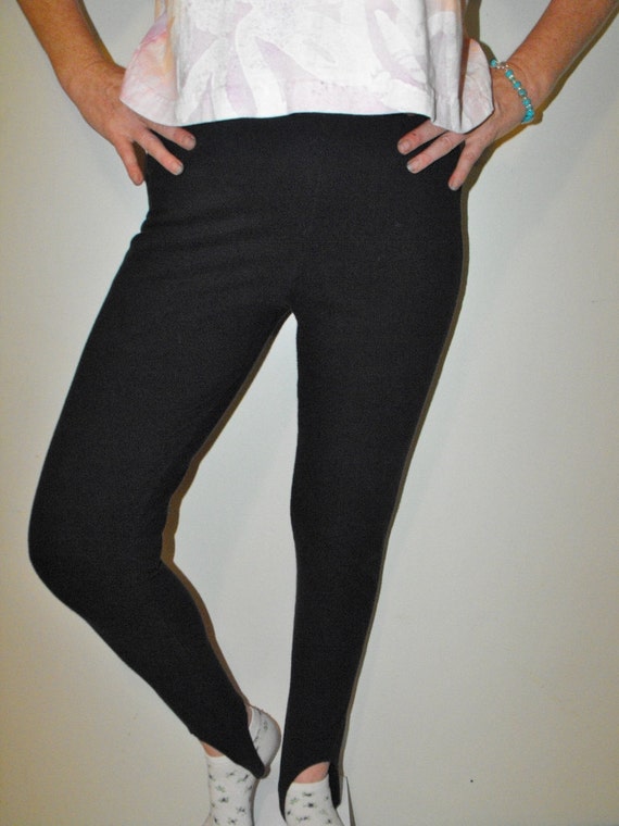 Shop by category Nice navy blue stirrup pants with a waist band thathas elastic in the back. There is a sewn crease down the front ofeach leg. Pants close with a hidden zipper and onebutton.
