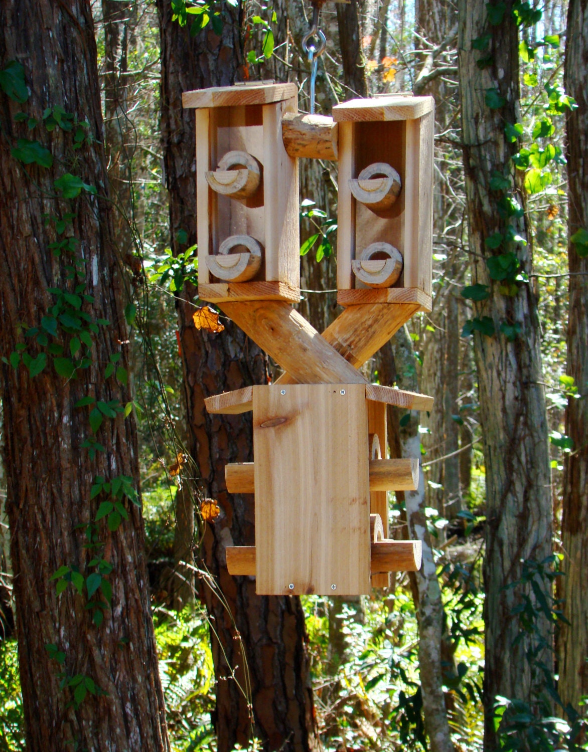Outdoor bird house feeder looks like 3 wooden birdhouses but