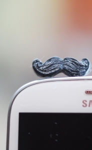 Mustache phone accessory. Movember plug for earphone jack. Fits iPhone 5 4 4s ,iPad ,Samsung galaxy s2 s3, 3.5mm output. Ohtteam for all