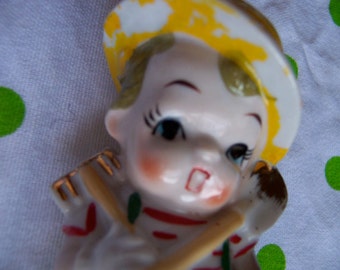 little boy and lamb figurine
