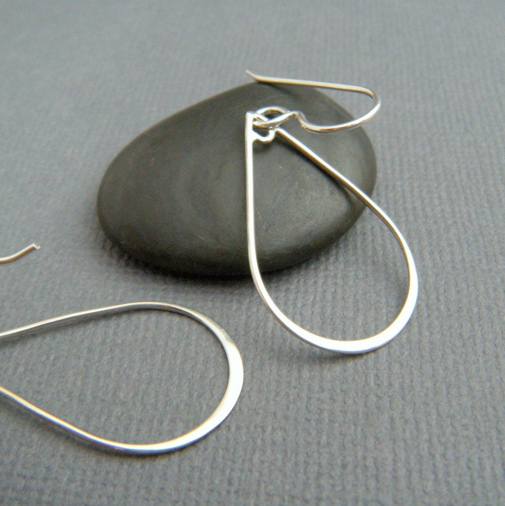 silver teardrop earrings. small silver hoop earrings. sterling