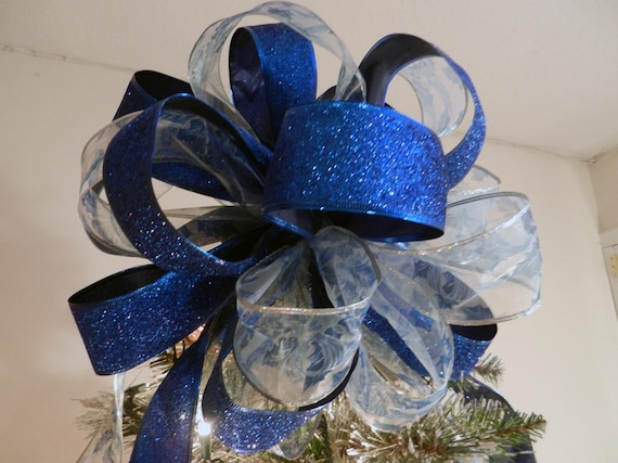 Large Christmas Tree topper bow made of a blue glitter ribbon