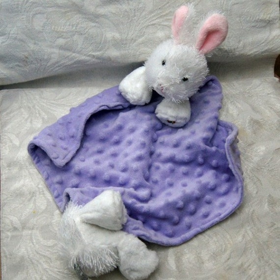 stuffed animal with blanket attached