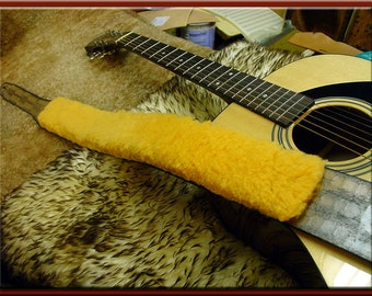 SHEEPSKIN PAD for your Guitar Strap. We will glue a sheepskin pad to your strap or ship it to you so you may attach it yourself.