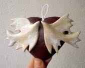 Two ceramic kissing birds on a ceramic heart . Wedding decoration, symbol of love.Valentine Day gift