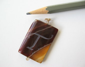 Agate pendant stone with sandblasted initial T