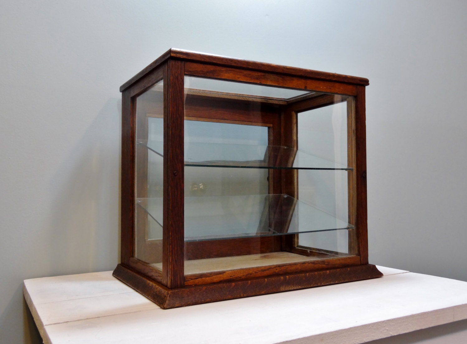 Antique wood and glass display cabinet