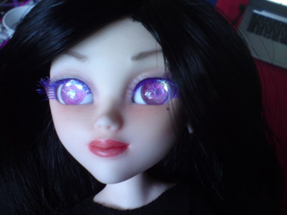 doll with pink eyes