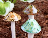 Three hand crafted ceramic mushrooms