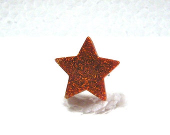 Small glittery chunky orange resin star ring