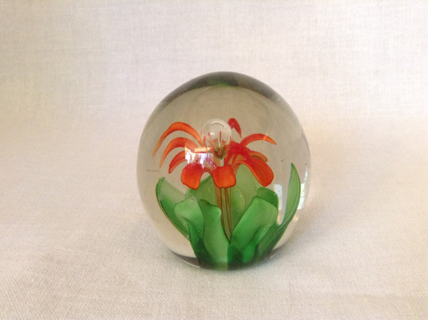 Beautiful Hand Blown Glass Paperweight With Orange Blossom and