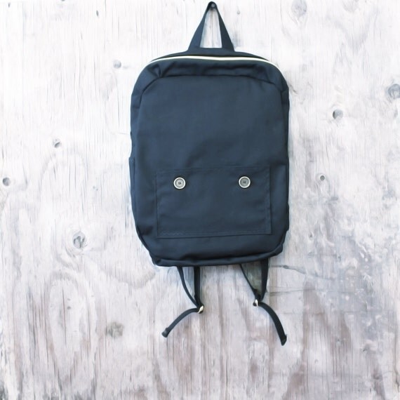 black backpack simple medium sized backpack with brass zipper