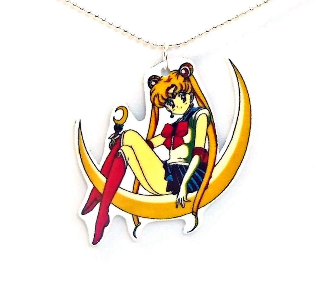 sailor moon sitting on moon