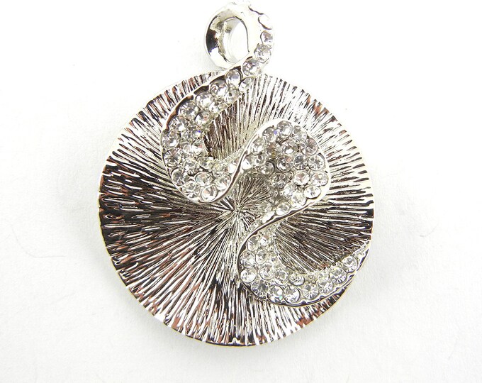 Round Textured Silver-tone Pendant with Rhinestone Swirl