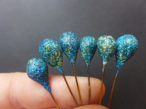 Crusty Crackle Pins. 6 teardrop polymer clay artisan head pins in blue with gold glitter shards.