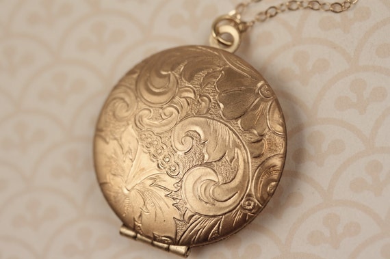 https://www.etsy.com/listing/170193197/floral-locket-necklace-14kt-long-gold?ref=sr_gallery_6&ga_original_query=1&ga_page=2&ga_search_query=vintage&ga_search_type=all&ga_view_type=gallery