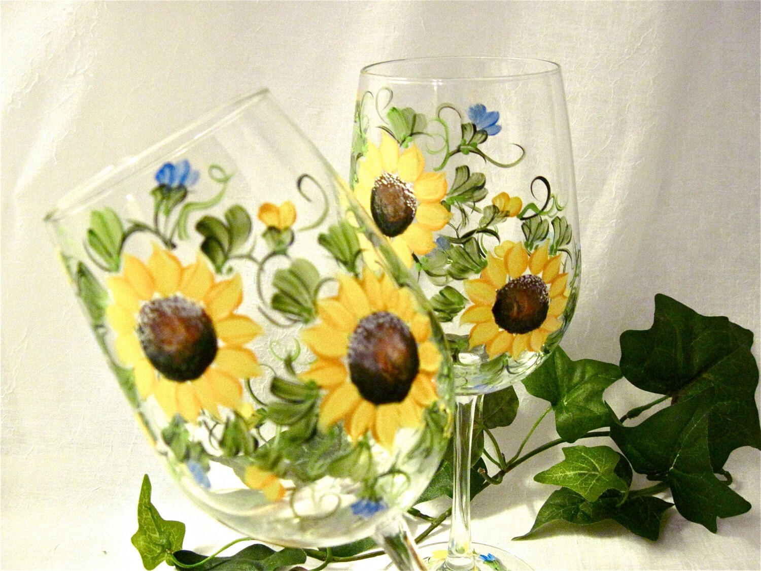 Sunflowers hand painted on a pair of wine glasses