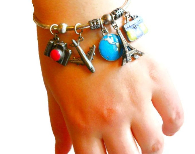 FREE SHIPPING Avon travel charm cuff bracelet marked nr silver plate with pewter charms - camera, plane, globe, Eiffel Tower, briefcase