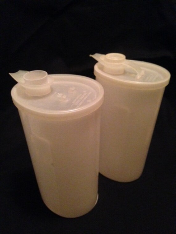Two Tupperware condiment containers.