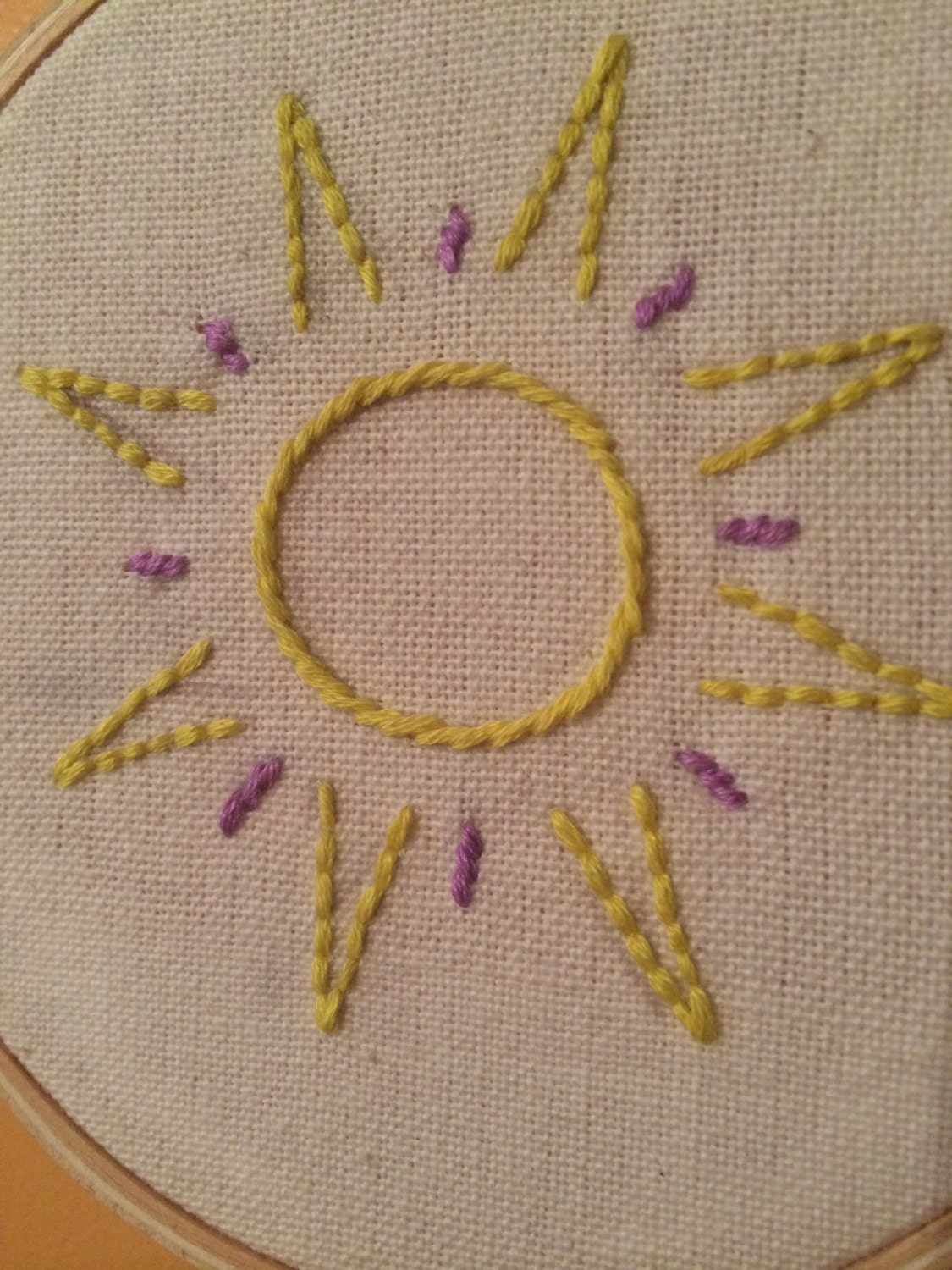 Hand embroidered sun hoop wall art