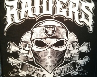 Raiders with Skulls Graphic T-Shirt.