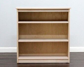 Birch Bookcase with two adjustable shelves, wide.
