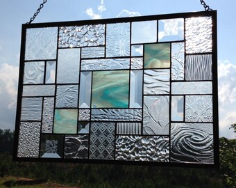 Sky Blue Opalescent Wispy stained glass panel with multiple-textured clear glasses & bevels to accentuate this lovely panel.