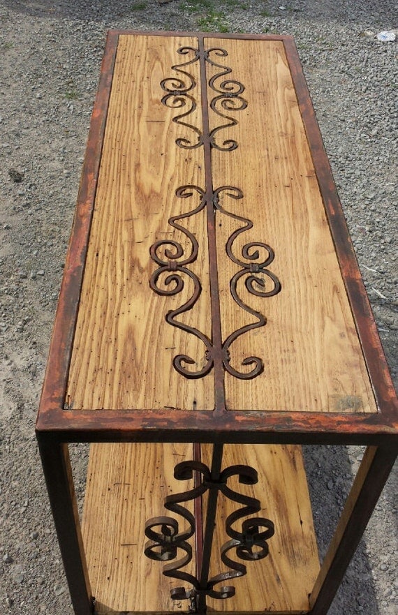 Handmade metal sofa table with reclaimed wood top and shelf.
