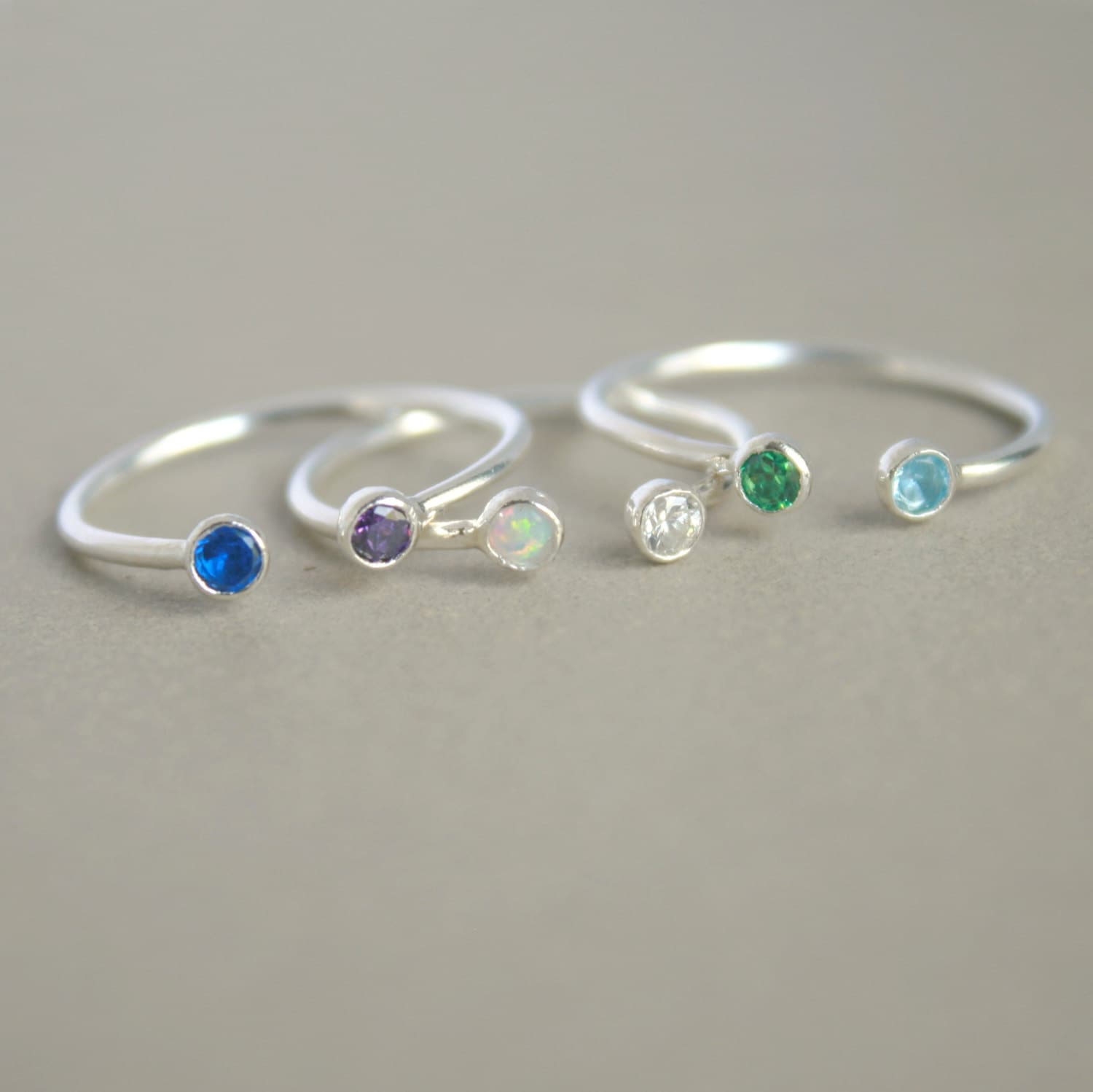 dual birthstone ring. two stone ring. gemstone couples ring.
