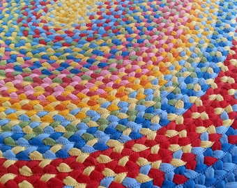 72"x 90" oval braided rug created from new and recycled t shirts