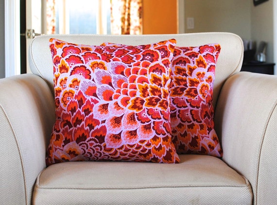Vibrant pink and orange decorative pillow by kangaroostitches