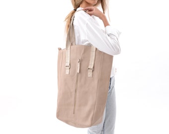 cream over shoulder bag