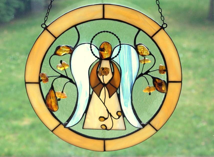 Big stained glass angel decorated with natural Baltic amber.