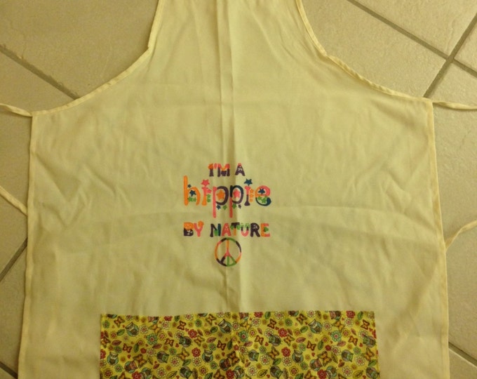 Full Adult Canvas Apron that ties in the back. Two yellow patterned pockets in front, "I'm a Hippie by Nature" painted on front.