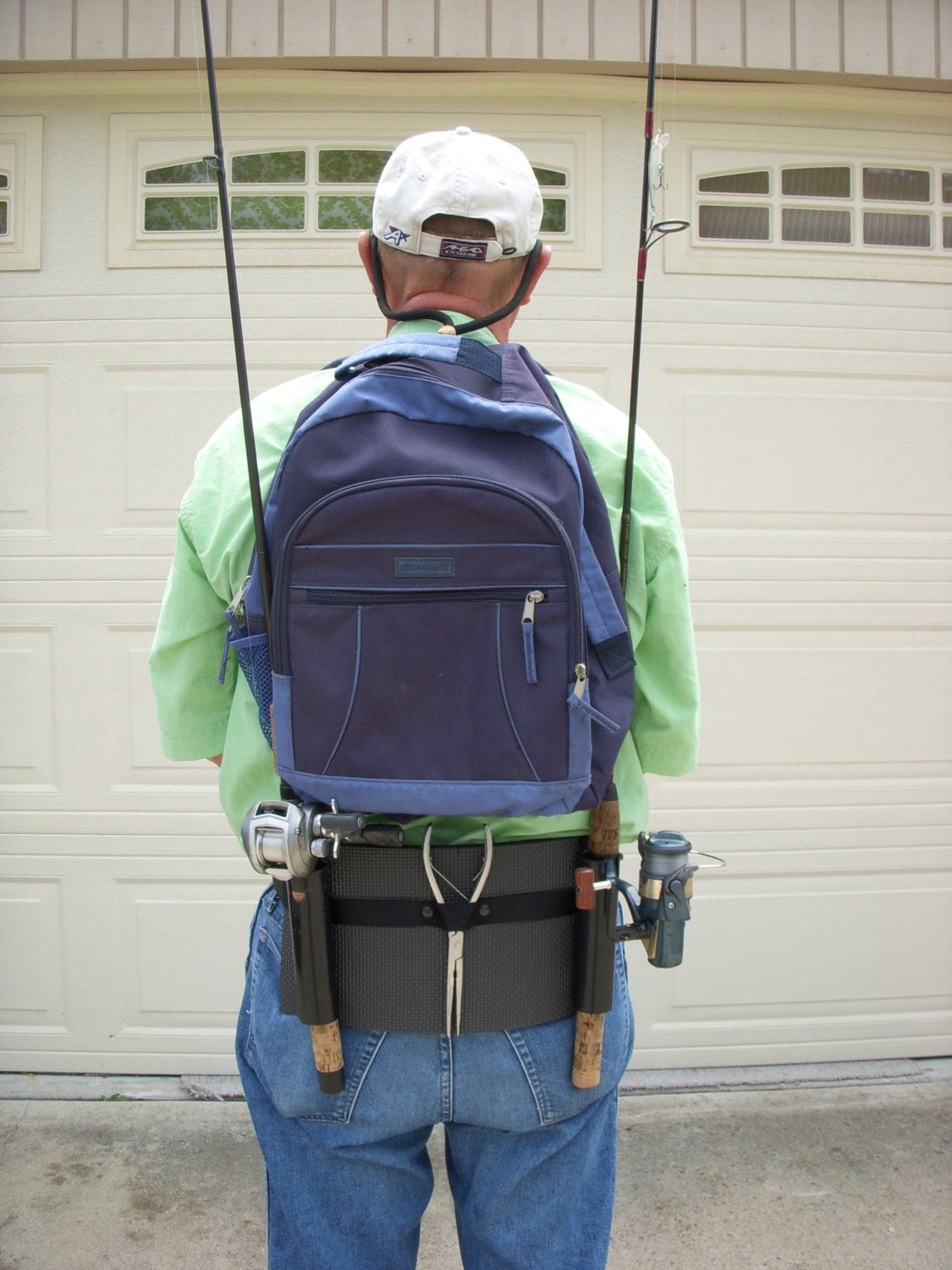 Backpack fishing rod holster / holder