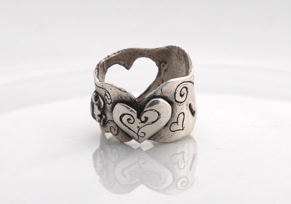 Unique scalloped shaped silver ring with cut out heart with