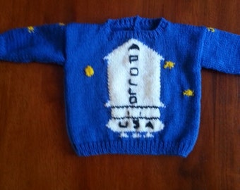 Knitting pattern Arthur Christmas Sweater in adult sizes.