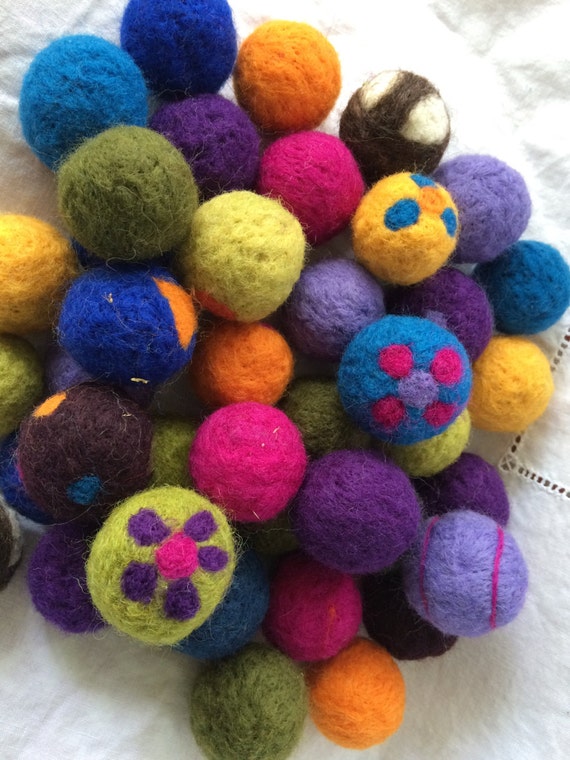 Needle felted wool cat toy balls with catnip inside.